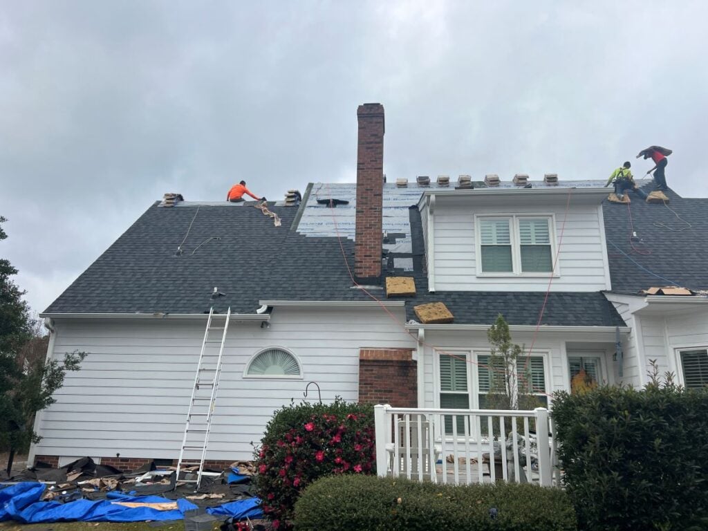 Tideline Roofing workers on charcoal roof